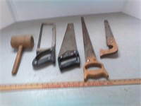 Various saws and wood mallet