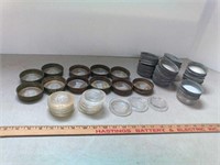 23 zinc canning lids, 11 metal rings and 24 glass