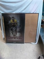 > Lance Armstrong and empty poster frames