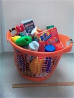 Laundry basket full of cleaning supplies
