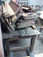 Large wooden work table with scrap wood,,