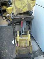 2 plastic mop buckets and janitor cart