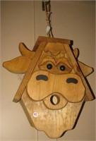 Homemade wood cow birdhouse. Measures 16" h x 16"