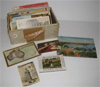 Small box of vintage postcards including sets