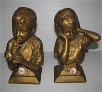 Pair of chalk ware boy and girl busts. Measures