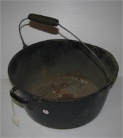 Vintage enamel kettle with wire and wood handle.