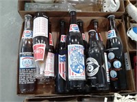 Assorted Pepsi and Coke pop bottles