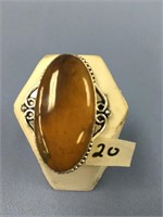 A variegated brown stone ring set in sterling silv
