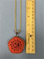 2" cinnabar pendant on a gold chain            (33