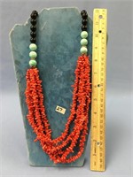 3 strand coral chip necklace with blue glass beads