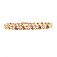 A Lady's Rope Bracelet with Rubies in 14K Gold