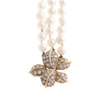 A Triple Strand of Pearls with Diamond Clasp