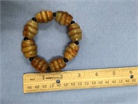 Butterscotch colored barrel beads made into a brac
