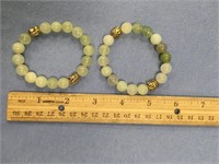 Lot of two jade and gold bead stretch bracelets