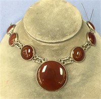 A toffee colored stone set in sterling silver, par