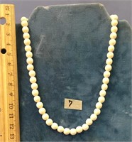 30" strand of ivory beads, the beads are approx. 1
