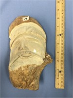 8" x 5" fossilized bone mask of a fisherman, Signe