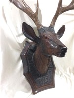 Mounted dear head carving