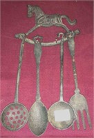 Cast iron rocking horse kitchen rack with utensils
