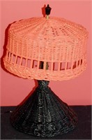 A PAINTED WICKER TABLE LAMP