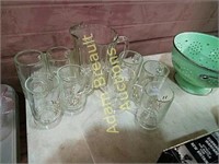 Glass pitcher and 8 assorted mugs
