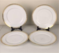 White and gold limoge dinner plates