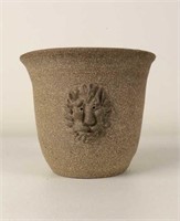 Earthen clay pot with a fun Lion face
