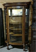 Oak curved glass china cabinet with Griffins