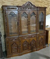 Heavily carved curio cabinet