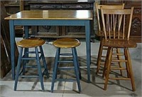 Bar type table with two stools and two chairs