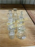7 assorted clear glass cruet bottles