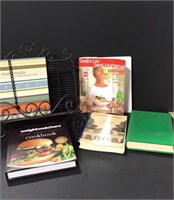 Lot of various cookbooks and cookbook stand