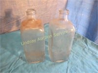 2 glass bottles Rochester Germicide Co.