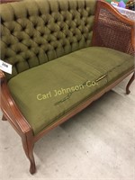 GREEN UPHOLSTERED ANTIQUE SETTEE (AS IS)