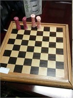 Large wooden chessboard and full set of pawns