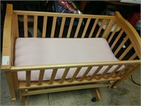 Wooden rocking baby bassinet