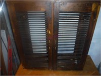 Cupboard with Slotted Doors