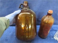 2 old amber glass bottles (1 gallon & smaller)