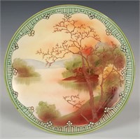 A HAND-PAINTED NIPPON PLAQUE WITH MORIAGE