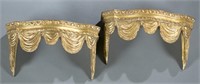 Pair of carved wooden gilt wall shelves.