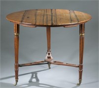 Round tiger maple table with married stretcher.