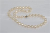 Well matched pearls with clasp marked 14K