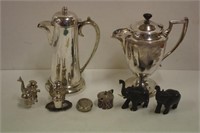Four sterling silver pepperettes on plated stands