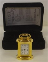 Miniature brass clock