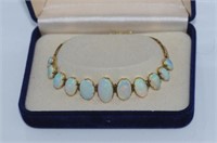 9ct yellow gold, eleven graduated opal bracelet