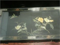 Black glass top oriental designed coffee table