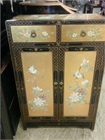 Gold and black oriental cabinet