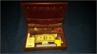 Box with miscellaneous items and 2 dollar bill