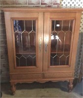Oak china cabinet with glass panel doors