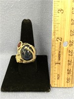 Sterling silver ring set with black stone, face is